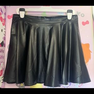 black pleated leather skirt